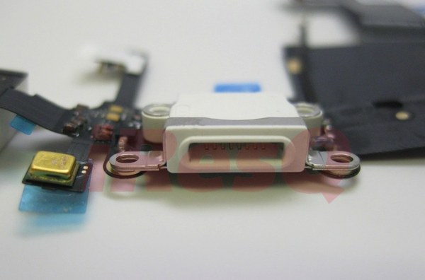 It's a 9-pin dock connector located in close proximity to the headphone — it sure seems like we are seeing the real iPad mini dock connector.