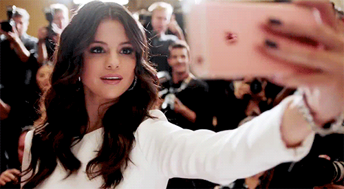 Selena Gomez showing off iPhone 6S' front flash feature in an iPhone commercial