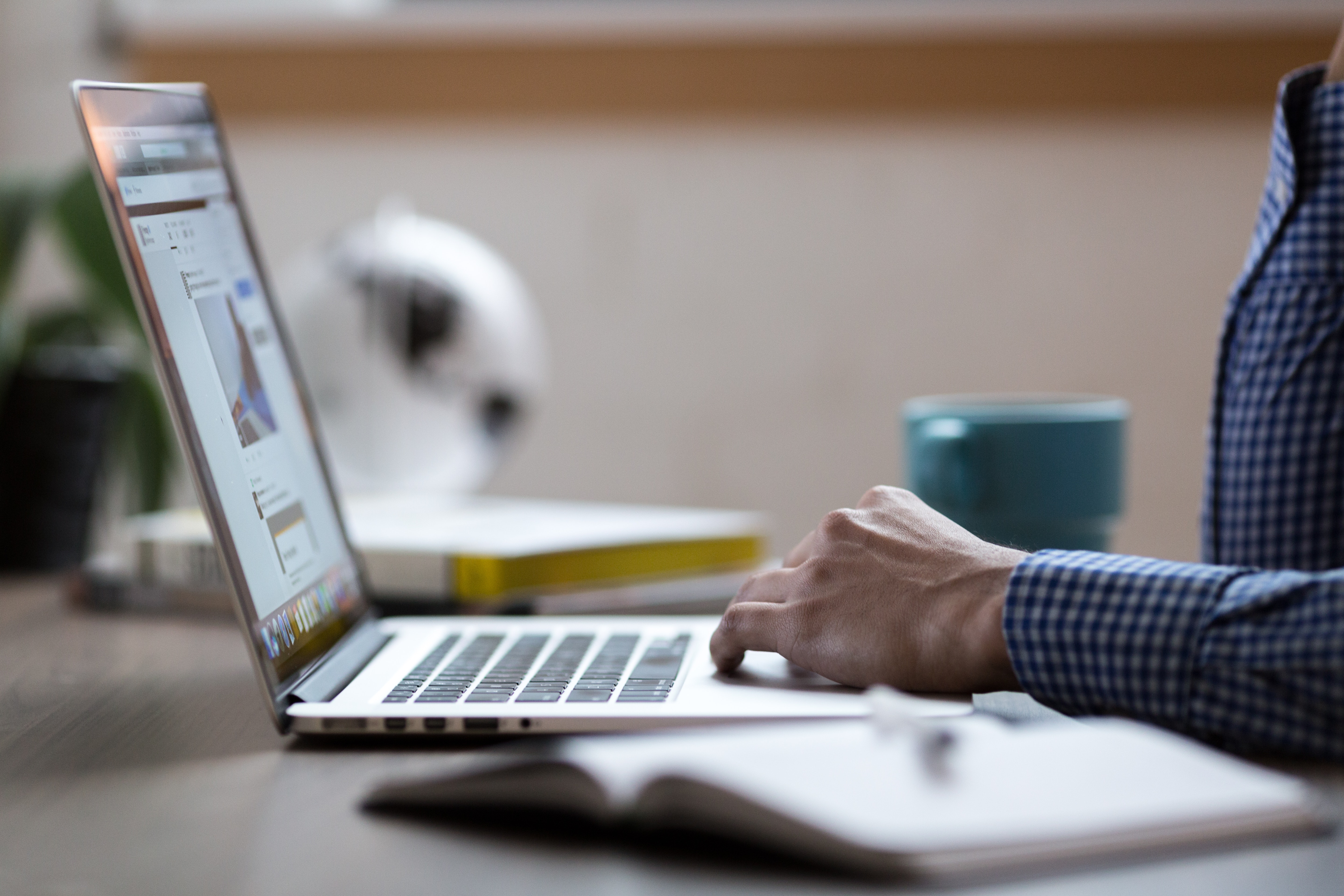 An image of a person using a Apple's Macbook.