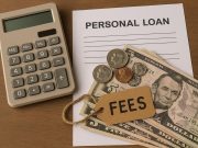 Personal loan application form with hidden fees highlighted and financial documents on a desk