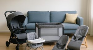 Compact baby stroller, foldable crib, space-saving high chair, and baby gear in modern condo setting