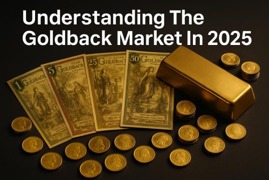 Physical Goldback notes displayed with gold bars symbolizing currency and precious metal market