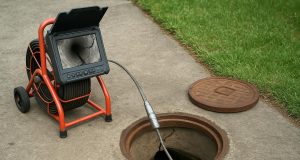 CCTV drain camera detecting cracks and damage in a residential sewer pipe underground
