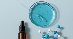 GHK-Cu peptide serum being applied to skin, promoting youthful and healthy complexion