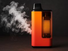 Mesh coil disposable vape device emitting dense vapor, illustrating enhanced flavor and output