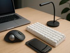 Modern office desk with wireless headphones, smart lamp, and ergonomic keyboard for productivity