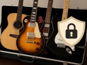 Electric and acoustic guitars displayed on stands, highlighting value for instrument insurance