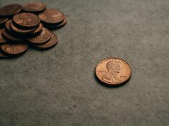Pile of U.S. pennies emphasizing their decreasing value and relevance in modern currency