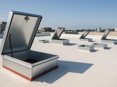 Retrofit roof hatches installed on a commercial building with rooftop access points